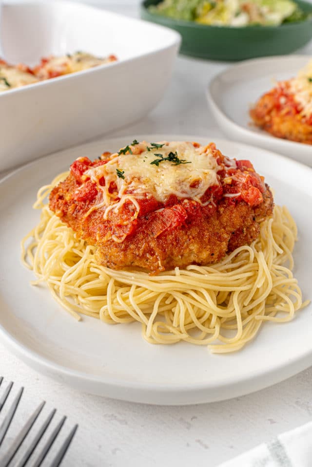 chicken on a plate with spaghetti