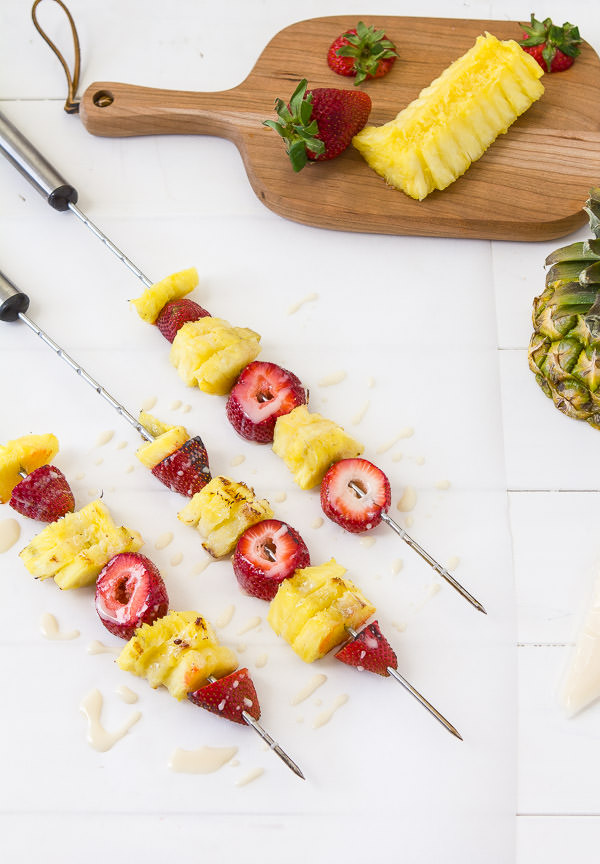 Grilled pineapple and strawberries with bourbon white chocolate glaze