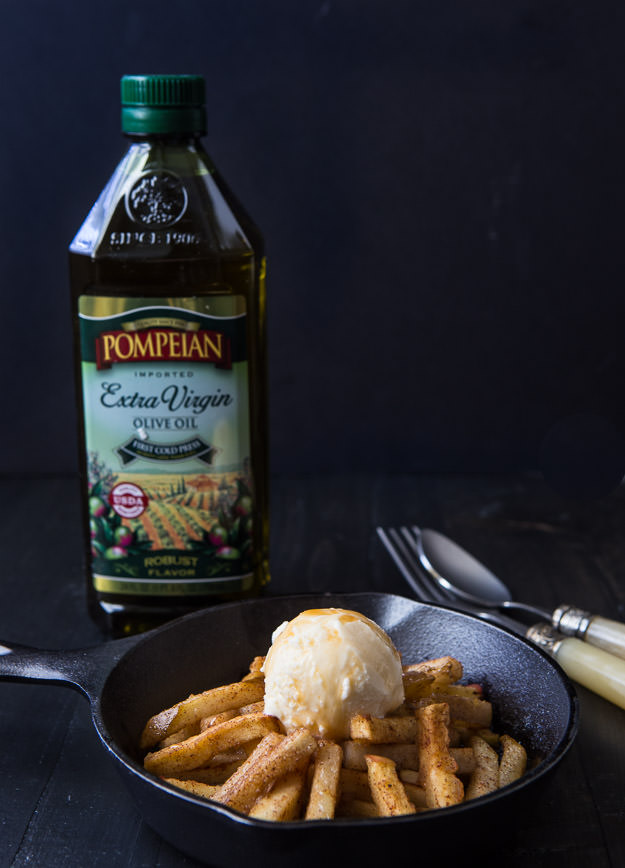 Baked pear and apple fries with a bottle of pompeian olive oil