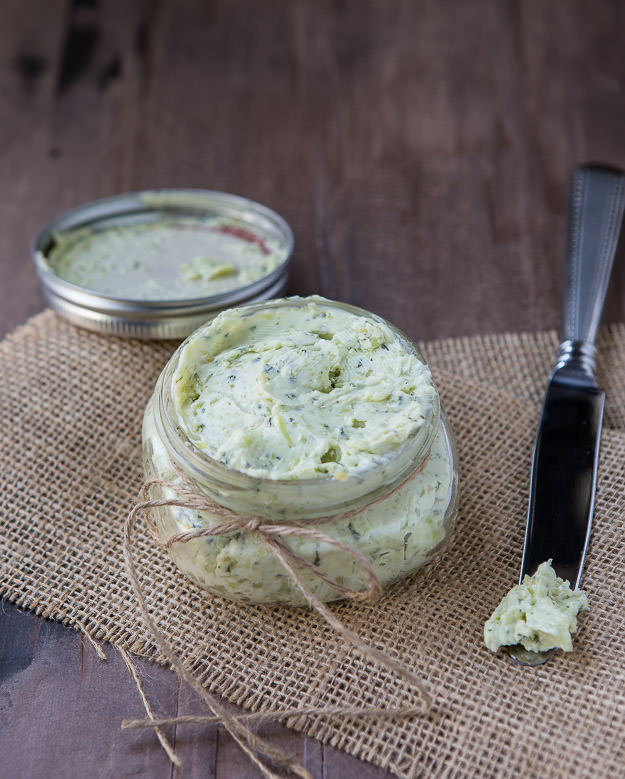 Basil Pesto Butter in a glass bowl with knife