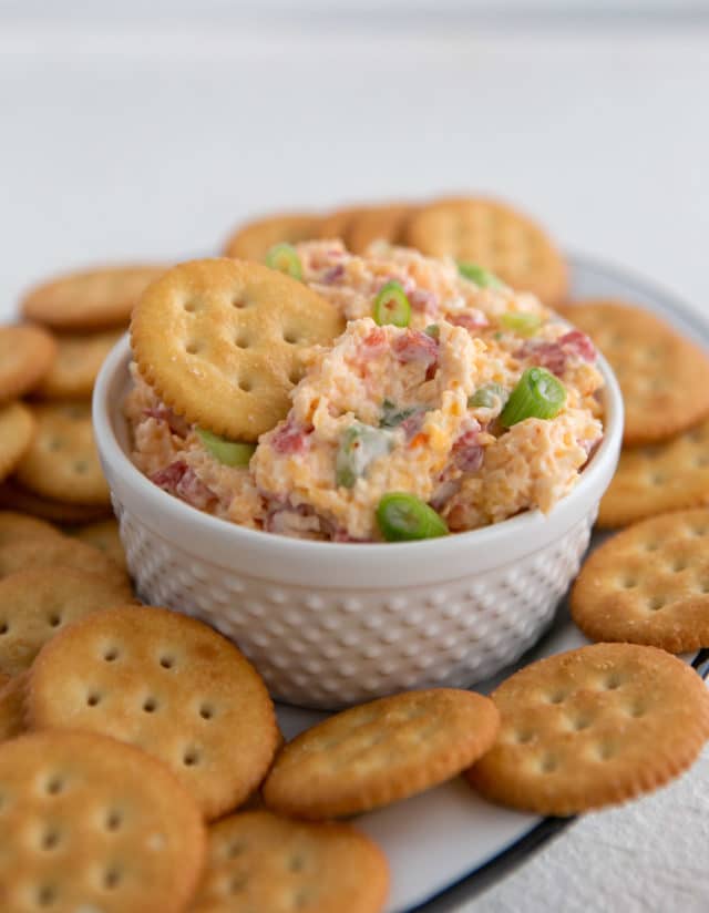 Homemade Pimento Cheese Dip  with crackers on a platter