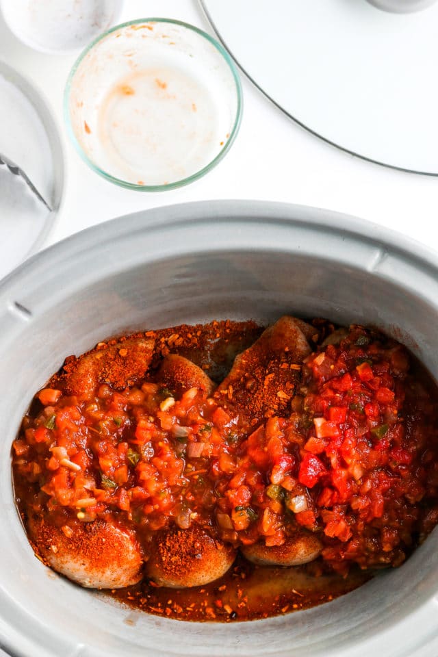 salsa covering chicken in crockpot