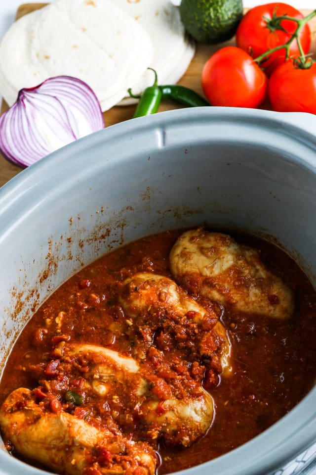 cooked chicken breasts with salsa in the crockpot