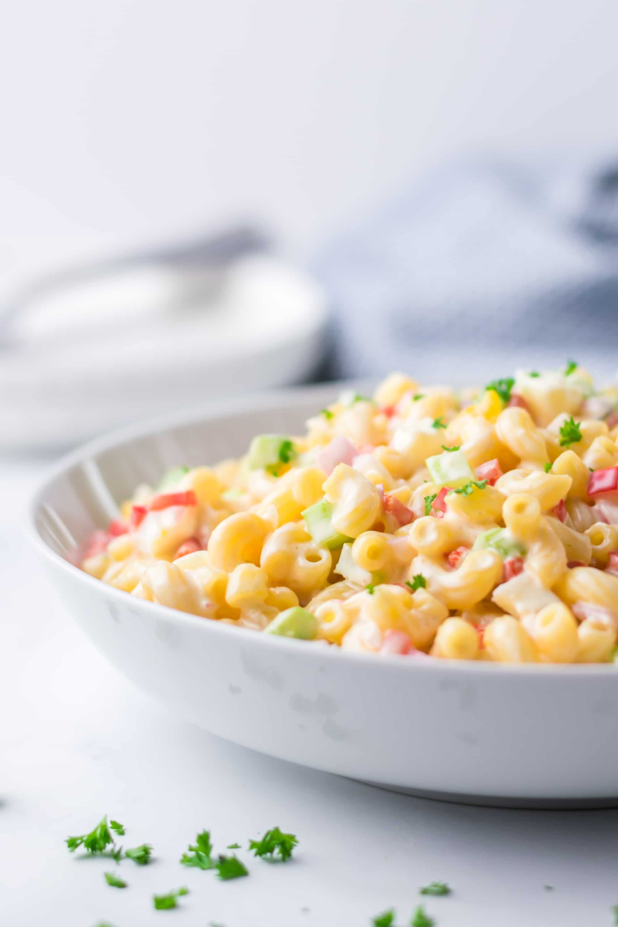 macaroni salad in a white bowl