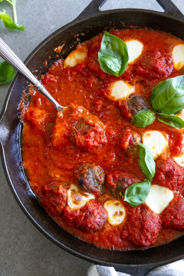 meatball and sauce with basil and cheese