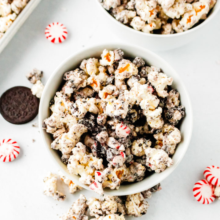 overhead shot of popcorn, candy and cookies in a bowl